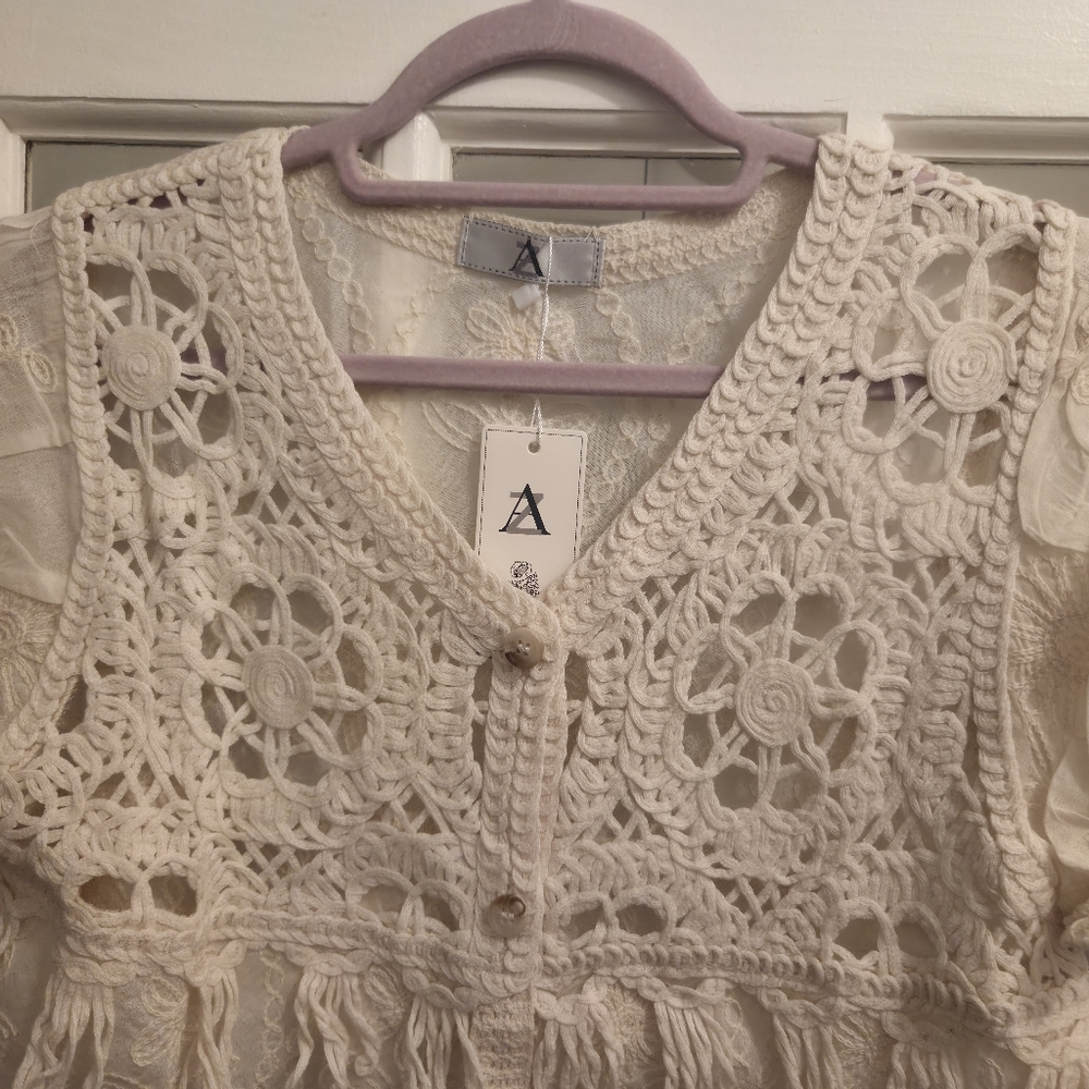 AZ Elegant Crochet Lace Blouse in Cream With Ruffled Sleeves & Fringe - Picture 6 of 10